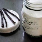 Cut Vanilla Beans and a Jar of Sugar